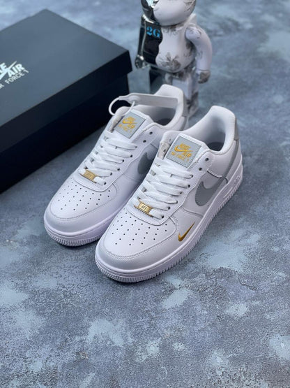 Nike Air Force grey and gold