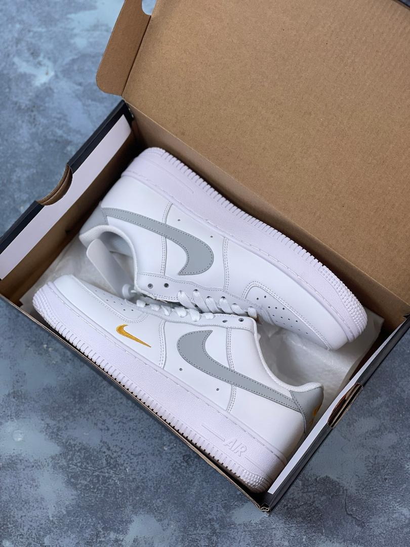 Nike Air Force grey and gold