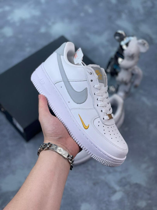 Nike Air Force grey and gold